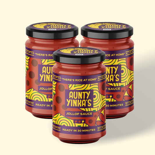 A jar of Jollof Rice Sauce labeled 'Aunty Yinka's', ready in 30 minutes, providing a quick and easy solution for making traditional Nigerian Jollof Rice.